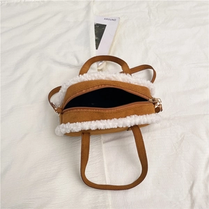 Brown faux suede handbag with white faux shearling trim and top handle for women