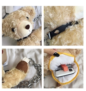 Detail view of plush bear bag with metallic chain strap and studded collar accents