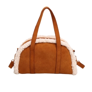 Vintage brown suede crescent handbag with soft white shearling trim and top handle