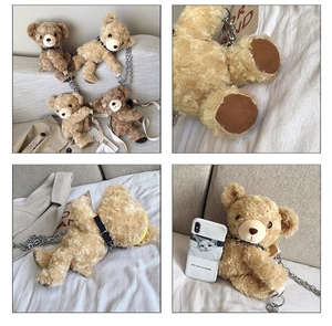 Detailed view of plush bear bag featuring soft faux fur texture and elegant metal chain