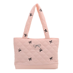 Pink quilted tote bag with black bow patterns and silver bow metal accessory detail