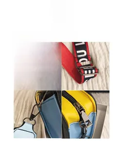 Détail macro du sac en cuir contrasté jaune et bleu avec large bandoulière tissée rayée