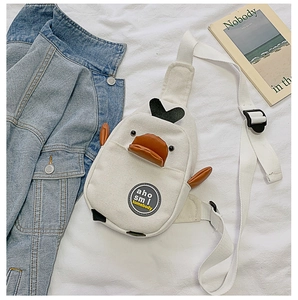 Detail shot of the cartoon duck canvas bag showing the adjustable strap and cute bill
