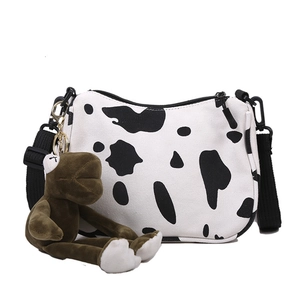 Borsa a tracolla in tela con stampa mucca e cinturino regolabile e ciondolo peluche