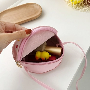 Internal view of pink donut crossbody bag for girls showing storage capacity and zipper