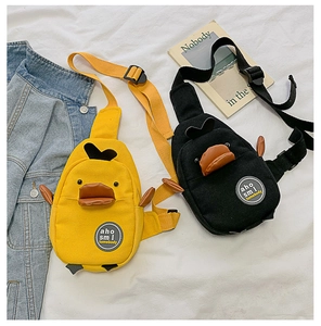 Detail of yellow and black cartoon duck canvas chest bags with adjustable nylon straps