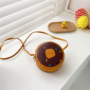 Detail of doughnut-shaped crossbody bag with colorful embroidery and Hello text