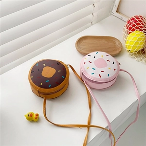 Detail of cute donut-shaped crossbody bags for girls with Hello print and colorful icing