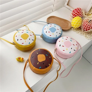 Detailed view of colorful donut-shaped crossbody bags for girls in various pastel shades