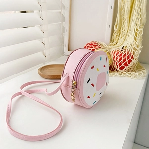 Cute pink donut-shaped crossbody bag for girls with colorful sprinkles and a flower pendant