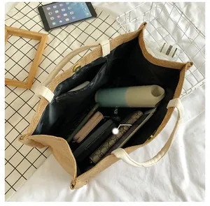 Detail of large canvas tote bag interior with magnetic closure and spacious compartment
