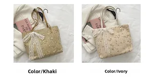 Close-up of lace bows and floral embroidery on straw tote bags in khaki and cream