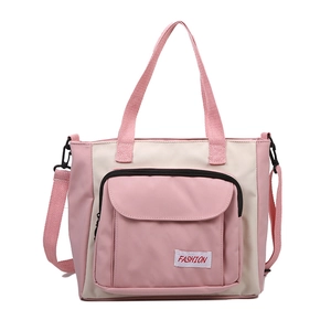 Pink and beige Oxford cloth tote bag with dual handles and adjustable shoulder strap