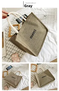 Detailed views of gray canvas tote bag featuring merci print and woven rope handles