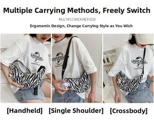 Cow print hobo bag showing versatile ways to wear it as a crossbody or shoulder bag