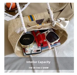 Detail view of woven straw tote bag interior with magnetic closure and silk scarf accessory