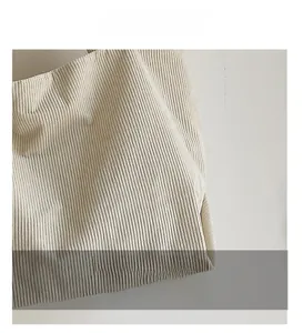 Detail of cream corduroy tote bag showing high-quality vertical knit texture and soft fabric