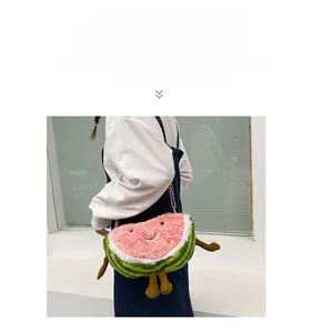 Detailed view of creative watermelon plush crossbody bag with cute smile and golden chain