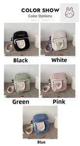 Five colors of canvas crossbody bags with cartoon patches and adjustable straps