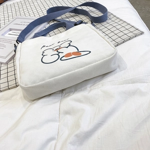 White canvas shoulder bag with cute cartoon bear print and blue adjustable fabric strap
