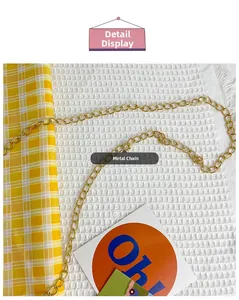 Detail of the high-quality gold metal chain strap on a plush crossbody bag