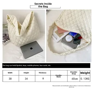 Detailed size chart and internal capacity view of white quilted puffer shoulder bag