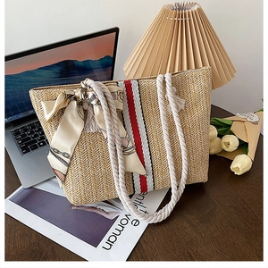 Colorful striped woven straw tote bag with cotton rope handles for summer beach holidays