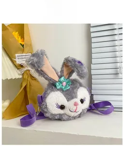 Detail of StellaLou plush bunny crossbody bag with purple strap and cute bow tie