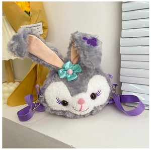 Detail of purple plush rabbit crossbody bag featuring soft fur and mint green bow