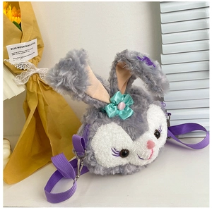 Detail of cute grey plush rabbit crossbody bag with purple bow and adjustable strap