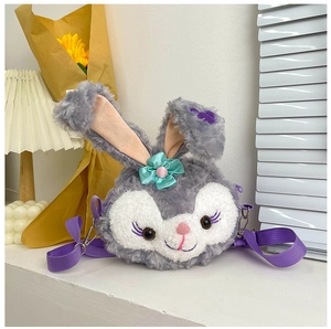 Detail of plush cartoon bunny crossbody bag featuring gray purple faux fur and ears