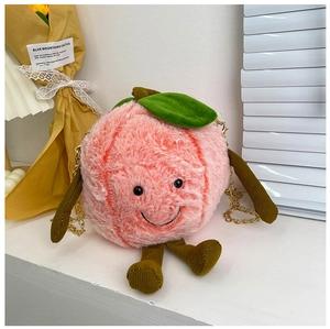 Detail of peach plush bag with soft texture, green leaf, and cute corduroy limbs