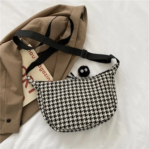 Minimalist houndstooth pattern crossbody saddle bag with adjustable shoulder strap