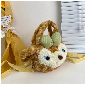 Detail of plush cartoon crossbody bag with green bow and adjustable yellow strap