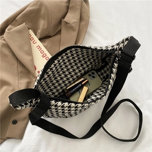 Japanese style black and white houndstooth crossbody bag showing internal capacity