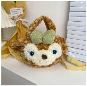 Detail of plush cartoon bear bag with soft brown fur and green striped bow accessory