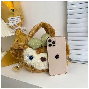 Detailed plush crossbody bag featuring cartoon face and iPhone for scale comparison