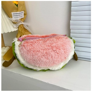 Macro shot of watermelon plush bag detailing the soft fuzzy texture and zipper closure