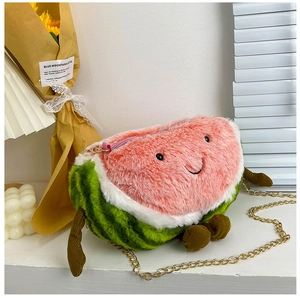 Detail of creative plush watermelon crossbody bag with cute face and metal chain strap