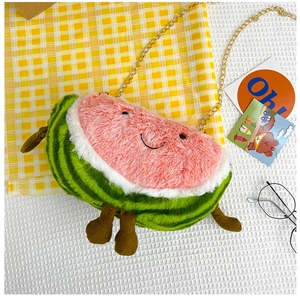 Close-up of watermelon plush bag featuring cute facial embroidery and gold chain strap