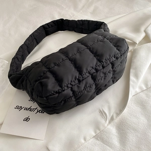 Minimalist black quilted puffer shoulder bag with elegant rhombus stitching and fold design