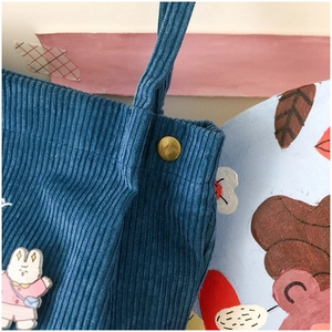 Blue corduroy shoulder tote bag with cute cartoon rabbit charm and gold metal buckle