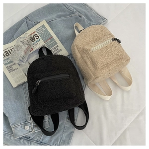 Mini lamb wool backpacks in black and beige with soft plush texture and zip pockets