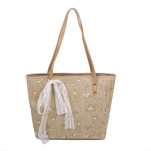 Summer straw tote bag with floral embroidery and white lace ribbon detail for women