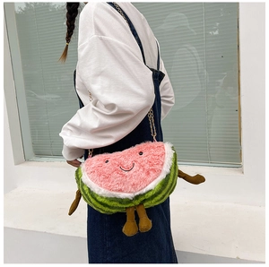 Detailed plush watermelon bag showing fuzzy texture, embroidered face and corduroy legs