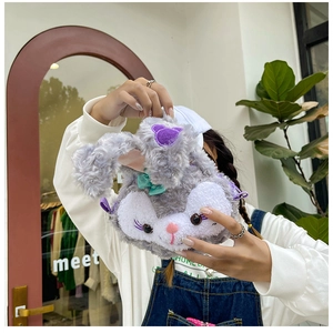 Detailed close-up of a purple plush StellaLou inspired crossbody bag with long ears