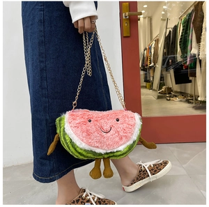Detail of creative plush watermelon crossbody bag with cute smiling face and metal chain
