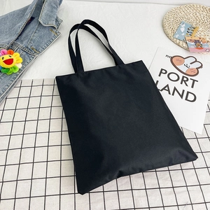 Minimalist black canvas tote bag with long straps for women on check background
