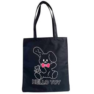 Black canvas tote bag for women featuring a minimalist cartoon animal and HELLO TOY print