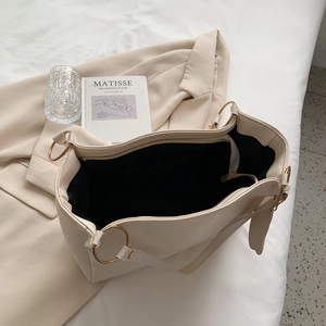 Elegant cream large leather tote bag with gold hardware and spacious interior view